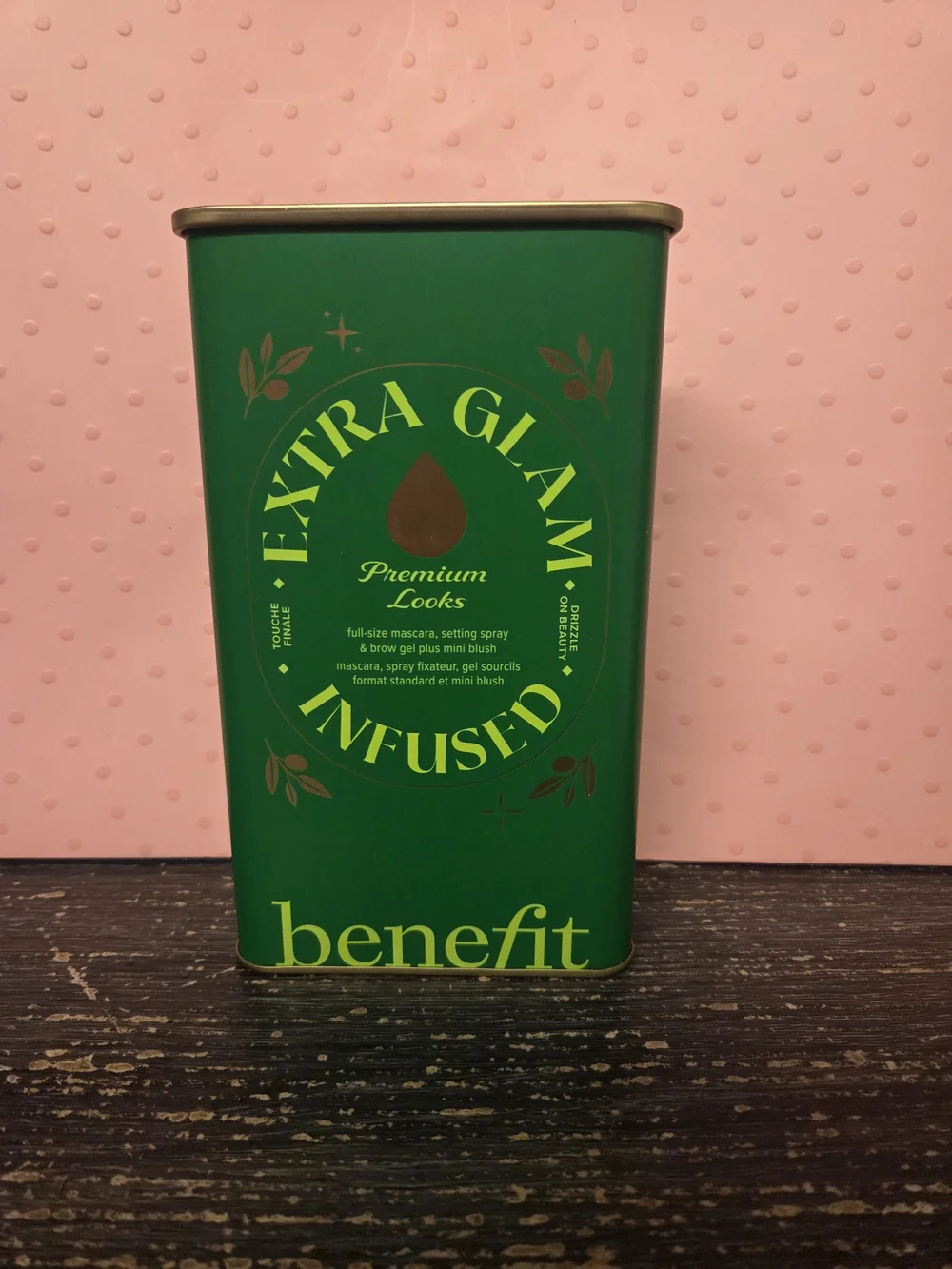 Benefit makeup collection with teal setting spray and green tin